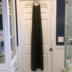 Olive green maxi dress with high neck and slit.